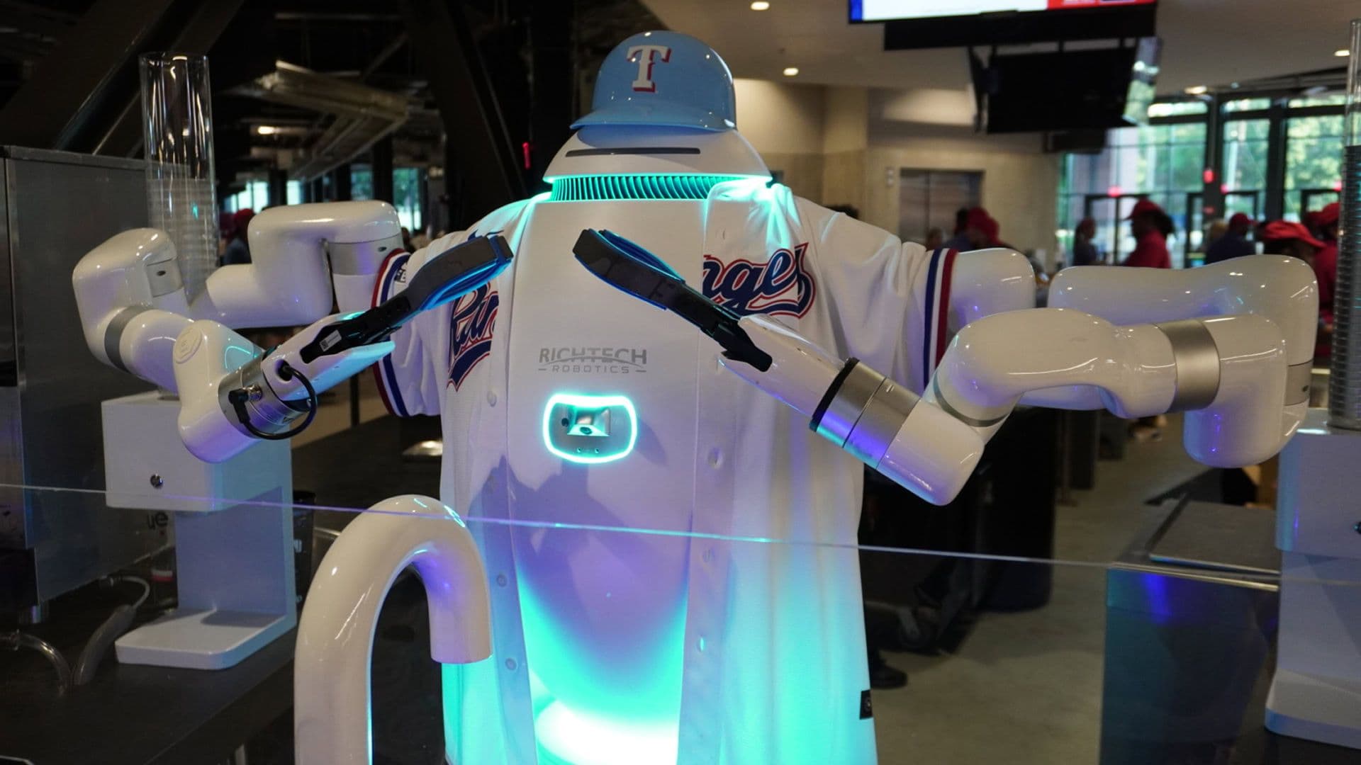 adam the robot in a baseball jersey
