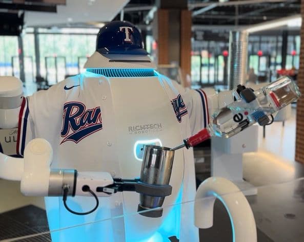 adam robot pours a cocktail