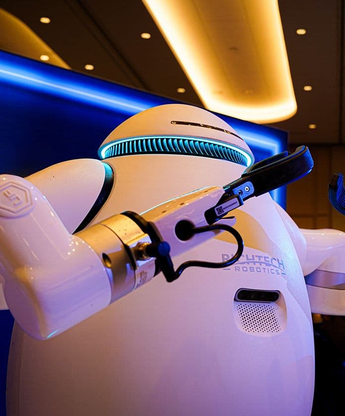 adam robot in hotel room