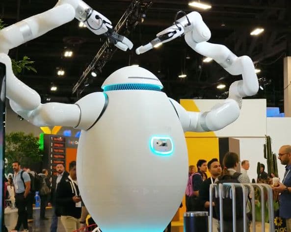 adam robot making a heart