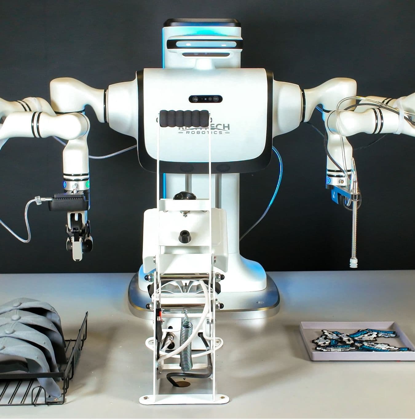 stationary dex robot ready to make a hat